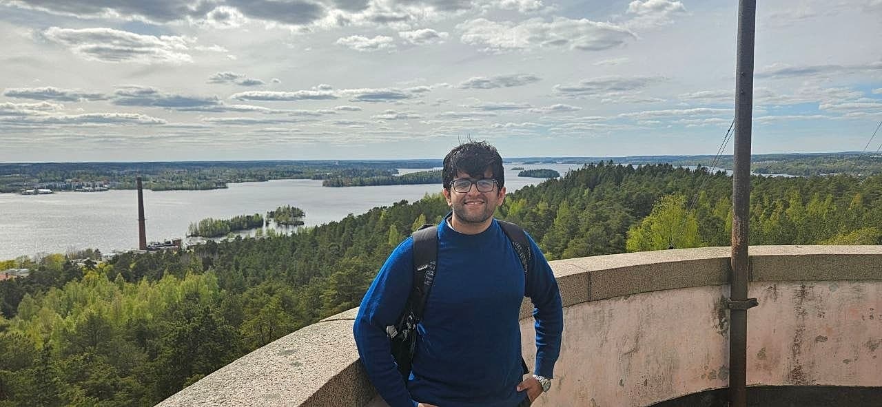 Honi overlooking Finnish lakes from a viewpoint tower